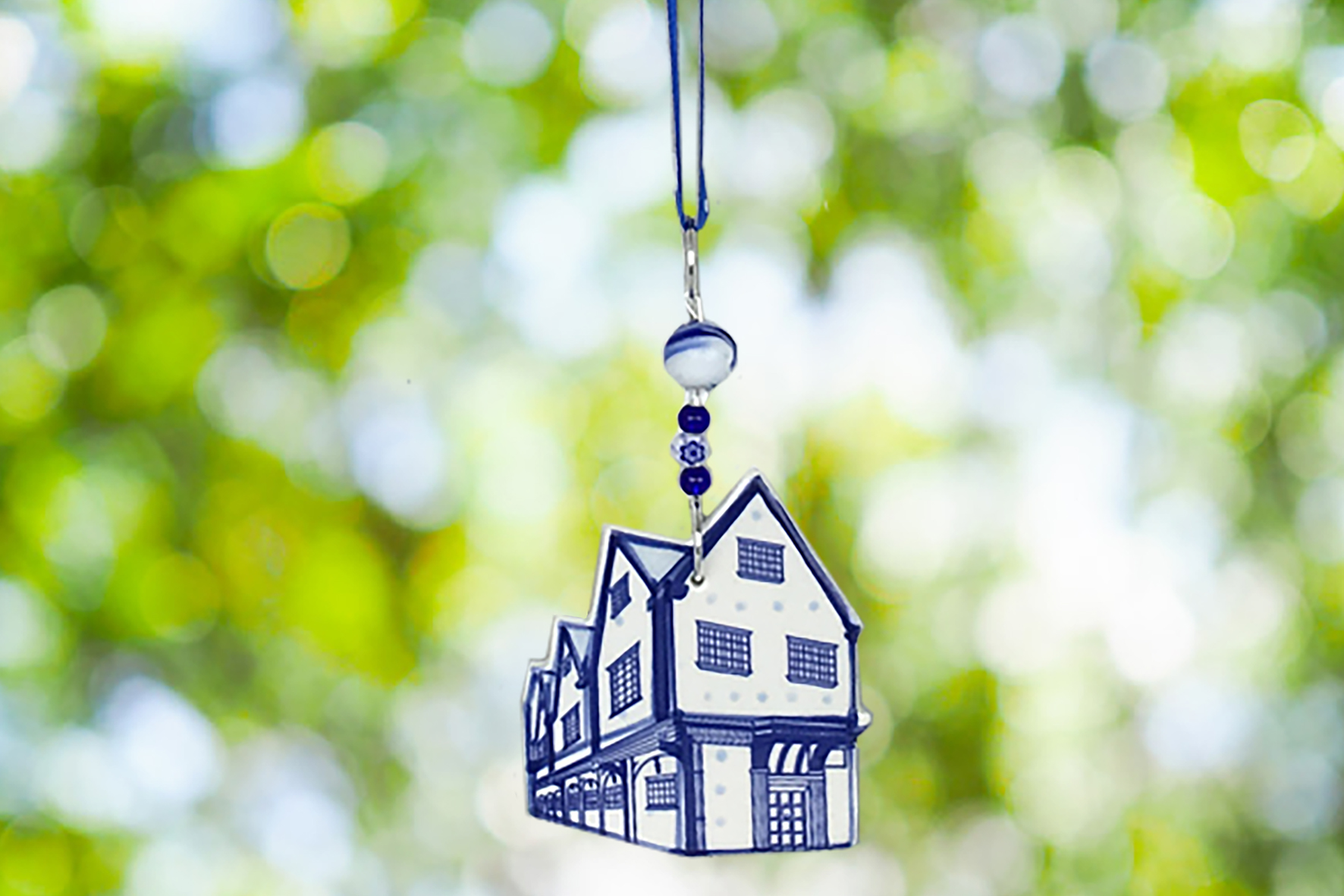 A finished bespoke ceramic decoration hanging outdoors