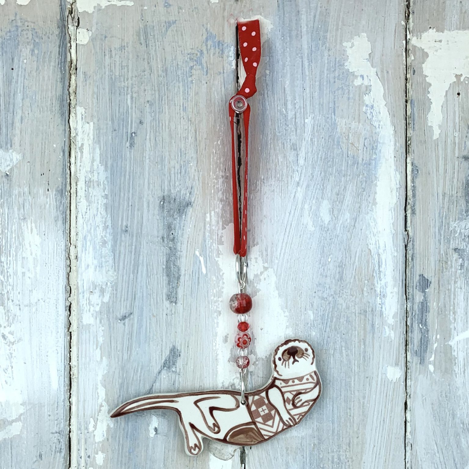 Otter in Fair Isle Jumper — handmade ceramic decoration
